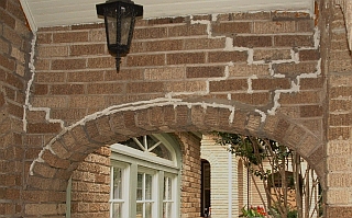 Brick Segmental Arch with mismatched mortar repairs