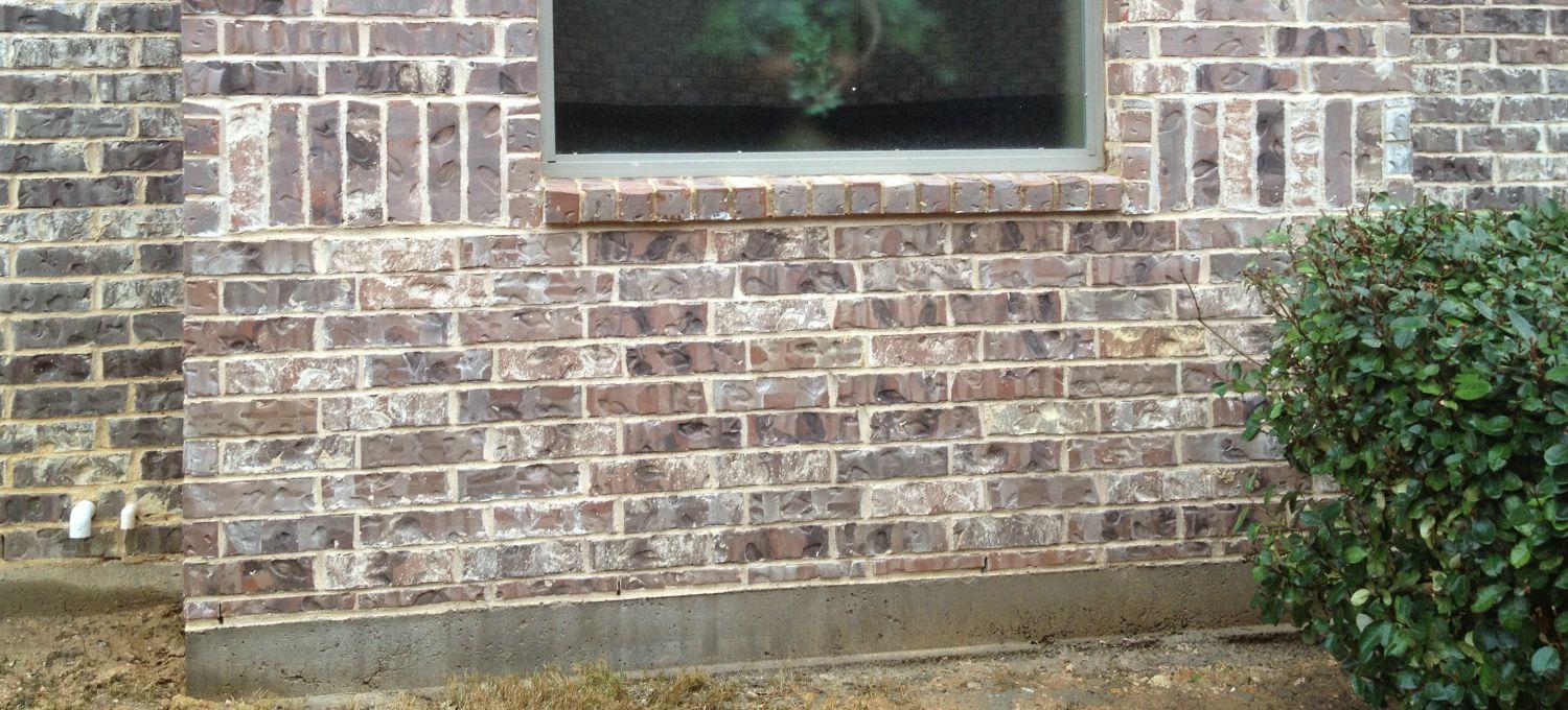 Completed brick and mortar modification to a defective modification of original brick and mortar structure